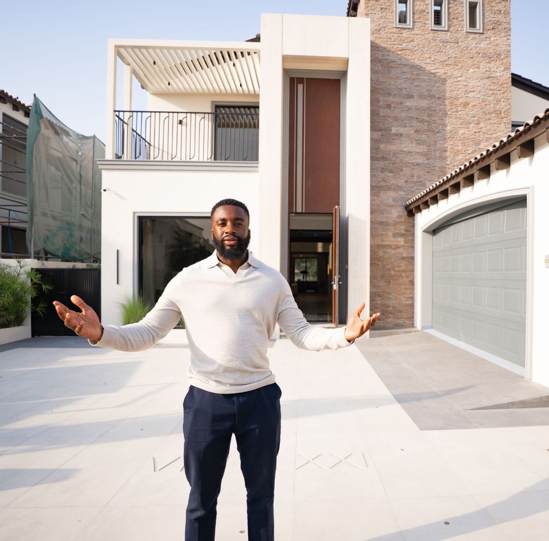 Pierre standing outside a property
