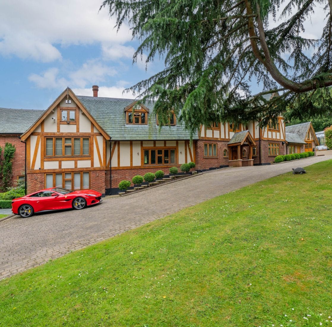 Luxury car outside a premium property